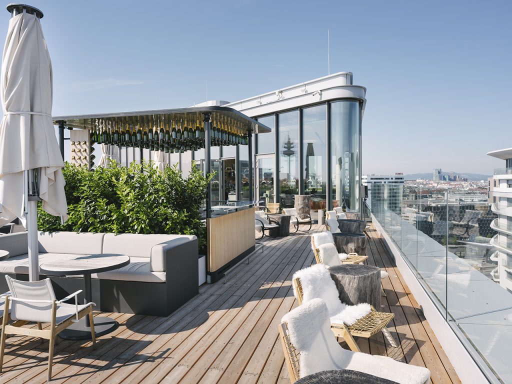 Terrace design of aurora rooftop bar hotel andaz by archisphere an interior architecture studio in vienna photo copyright by christof wagner